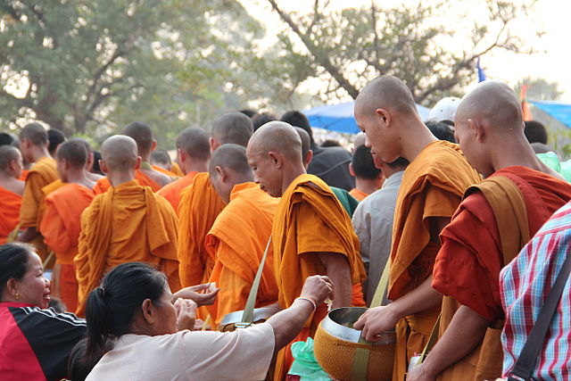 File:Monks collecting alms - Bun Vat Phu.JPG