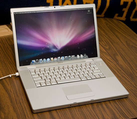 File:MacBook Pro situated on a wooden table.jpg