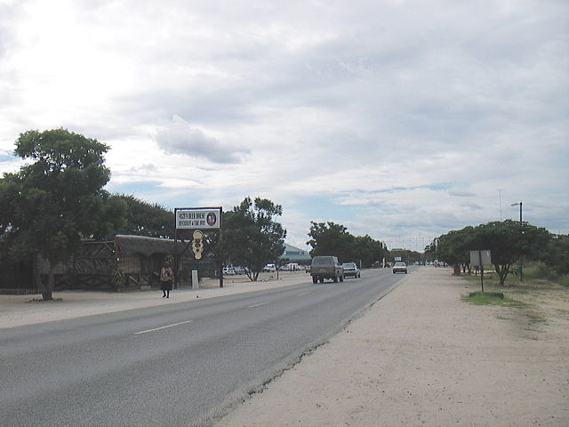 File:Ozzys Beerhouse and Eugen Kakukuru Street in Rundu, Namibia, March 2006.jpg