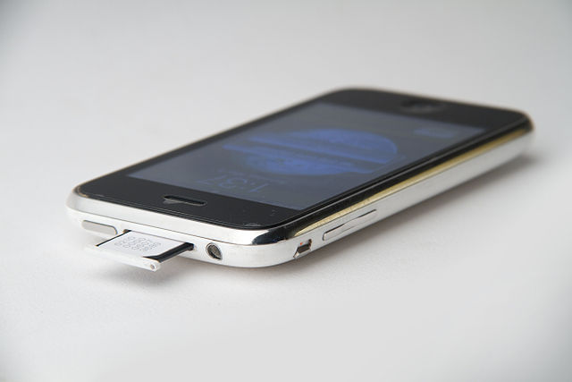 File:File-Top and left side of iPhone 3G white showing the standby button, sim tray, headphone plug, silent switch and volume buttons showing the sim tray half pulled out.JPG