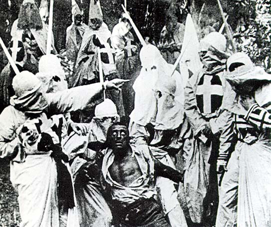 File:Birth-of-a-nation-klan-and-black-man.jpg